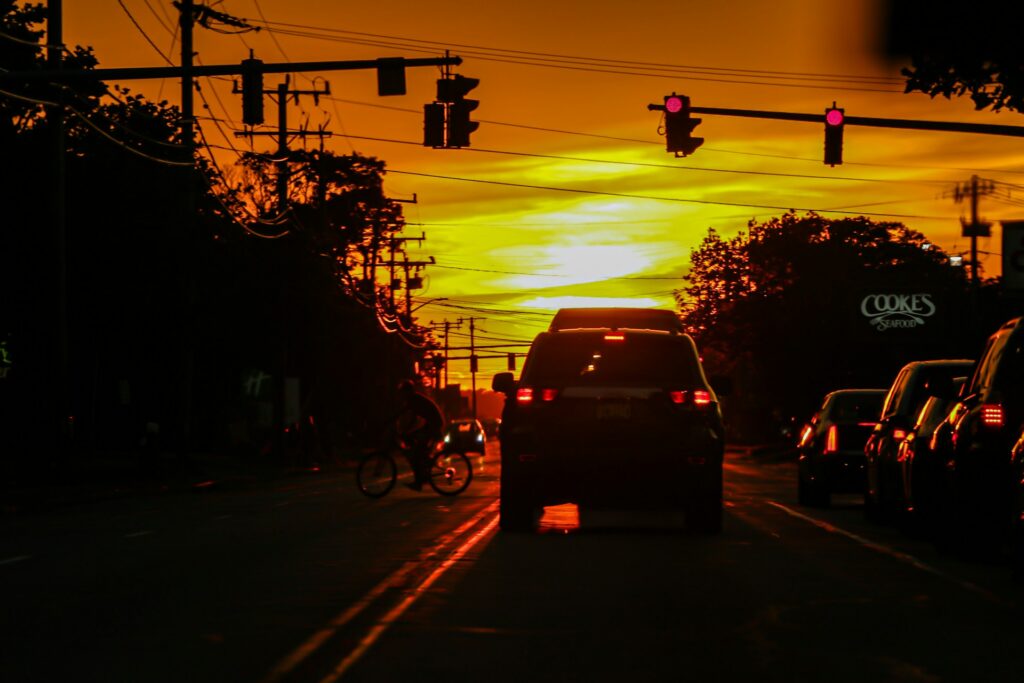 Driving down the road at sunset – a reflection on divine guidance.
