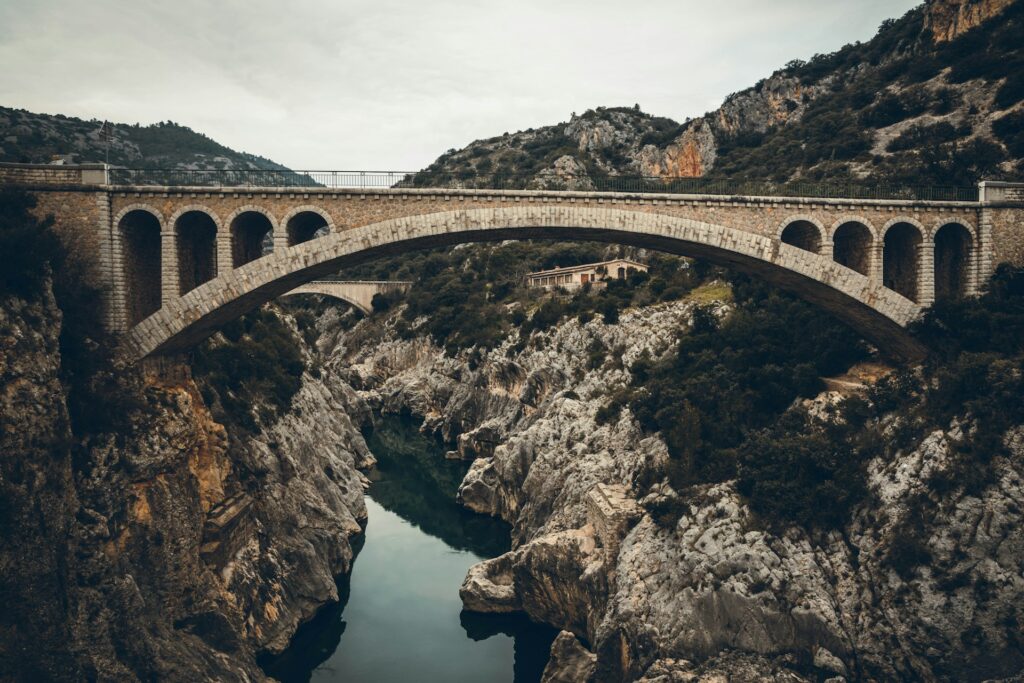 A symbolic bridge representing bridging the post-Christian chasm, illustrating the journey of guiding skeptics and seekers toward faith through relational evangelism.  Photo credit: Adrien Cesard | Unsplash